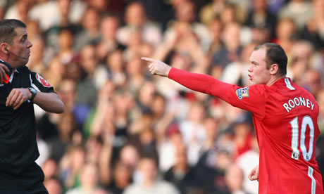 Wayne Rooney reacts to being shown the red card by Phil Dowd